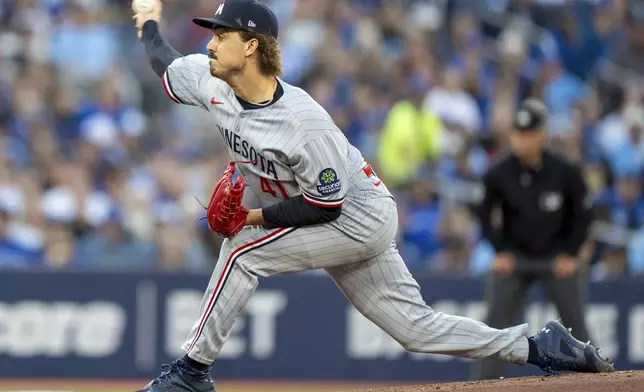 Minnesota Twins starting pitcher Joe Ryan throws in first-inning baseball game action against the Toronto Blue Jays in Toronto, Monday, Aug. 25, 2025. (Frank Gunn/The Canadian Press via AP)