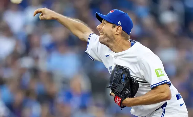 Toronto Blue Jays starting pitcher Max Scherzer throws in first-inning baseball game action against the Minnesota Twins in Toronto, Monday, Aug. 25, 2025. (Frank Gunn/The Canadian Press via AP)