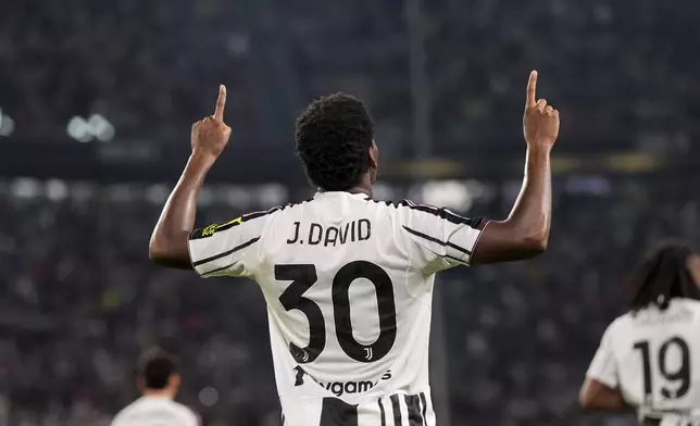 Juventus's Jonathan David celebrates after scoring the first goal for his team during the Italian Serie A soccer match between Juventus and Parma at the Juventus Stadium in Turin, Italy, Sunday, Aug. 24, 2025. (Fabio Ferrari/LaPresse via AP)