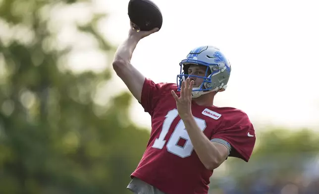 Detroit Lions quarterback Jared Goff runs drills during NFL football training camp Sunday, Aug. 3, 2025, in Allen Park, Mich. (AP Photo/Ryan Sun)