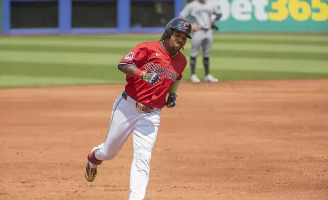 Cleveland Guardians' Jose Ramirez rounds third base after hitting a two-run home run off Minnesota Twins relief pitcher Jose Urena during the first inning of a baseball game, Sunday, Aug. 3, 2025, in Cleveland. (AP Photo/Phil Long)