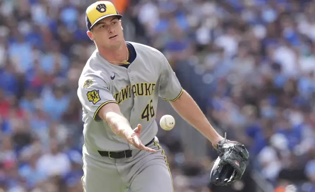 Milwaukee Brewers pitcher Quinn Priester (46) throws to out Toronto Blue Jays' Alejandro Kirk at first base during fourth inning MLB baseball action in Toronto on Saturday, August 30, 2025. (Frank Gunn/The Canadian Press via AP)