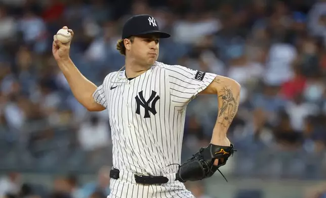 New York Yankees' Cam Schlittler throws against the Washington Nationals during the first inning of a baseball game, Monday, Aug. 25, 2025, in New York. (AP Photo/Noah K. Murray)