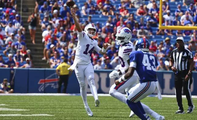 Buffalo Bills quarterback Mike White (14) throws a pass for a touchdown during the second half of an NFL preseason football game against the New York Giants Saturday, Aug. 9, 2025, in Orchard Park, N.Y. (AP Photo/Jeffrey T. Barnes)