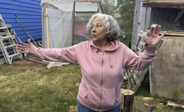 Gloria Simeon, co-founder of the Mother Kuskokwim Tribal Coalition, speaks during an interview outside her smokehouse in Bethel, Alaska, on June 18, 2025. (AP Photo/Mark Thiessen)