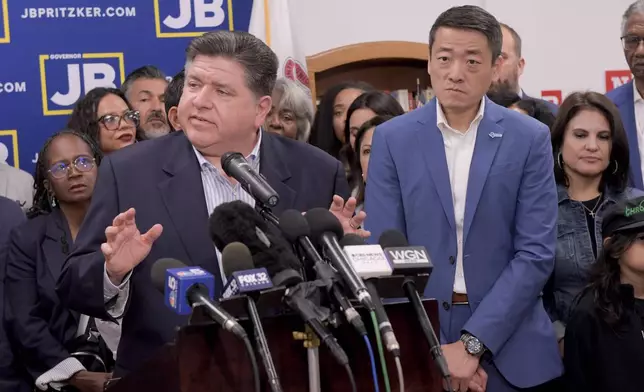 Texas House Democrats join Illinois Governor JB Pritzker speaks about the Texas Republican plans to redraw the House map during a press conference at the Democratic Party of DuPage County office in Carol Stream, IL on Sunday, Aug. 3, 2025. (AP Photo/Mark Black)