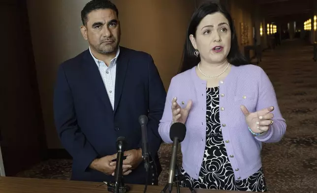 State Reps. Armando Walle, left, and Ana Hernandez, both Democrats from Houston, speak during a news conference at the National Conference of State Legislatures Legislative Summit, Monday, Aug. 4, 2025, in Boston. (AP Photo/Michael Dwyer)