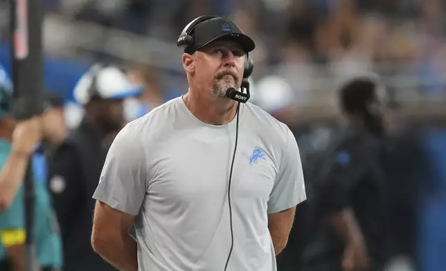 Detroit Lions head coach Dan Campbell watches from the sideline during the first half of an NFL preseason football game against the Miami Dolphins Saturday, Aug. 16, 2025, in Detroit. (AP Photo/Paul Sancya)