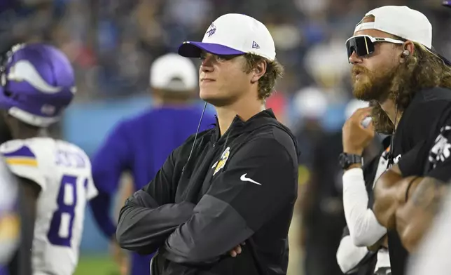 Minnesota Vikings quarterback J.J. McCarthy (9) on the sidelines during the second half of a preseason NFL football game against the Tennessee Titans, Friday, Aug. 22, 2025, in Nashville, Tenn. (AP Photo/John Amis)