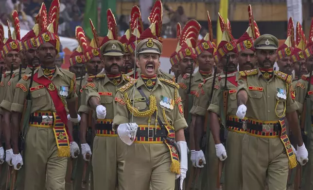 Indian paramilitary soldiers march during India's Independence Day celebrations in Srinagar, Indian controlled Kashmir, Friday, Aug. 15, 2025. (AP Photo/ Dar Yasin )