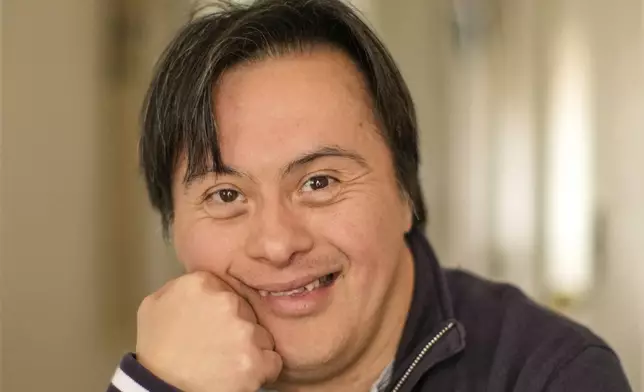 Actor Sebastián Solorza, who has Down syndrome and aims to run for president as an independent candidate, poses for a photo at his home in Santiago, Chile, Thursday, July 31, 2025. (AP Photo/Esteban Felix)