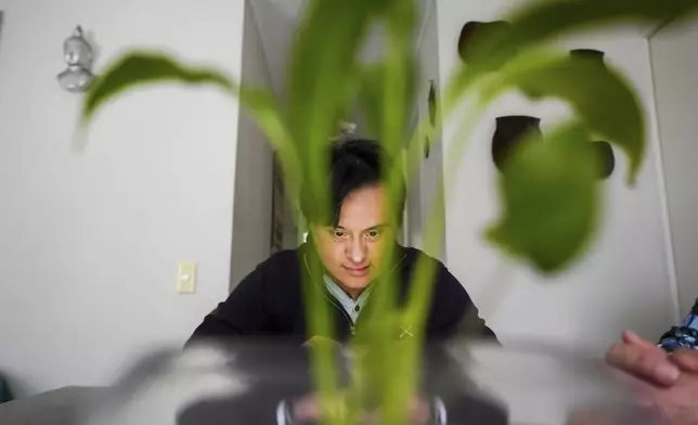 Actor Sebastián Solorza, who has Down syndrome and aims to run for president as an independent candidate, relaxes in his home in Santiago, Chile, Thursday, July 31, 2025. (AP Photo/Esteban Felix)