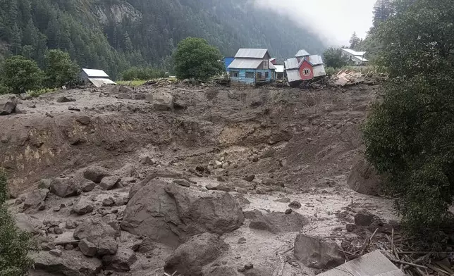 Buildings damaged in flash floods caused by torrential rains are seen in a remote, mountainous village, in Chositi area, Indian controlled Kashmir, Thursday, Aug. 14, 2025. (AP Photo)