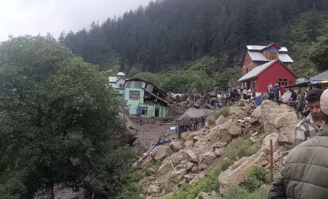 Buildings damaged in flash floods caused by torrential rains are seen in a remote, mountainous village, in Chositi area, Indian controlled Kashmir, Thursday, Aug. 14, 2025. (AP Photo)