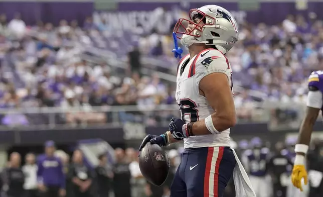 New England Patriots wide receiver Efton Chism III celebrates after scoring during the first half of a preseason NFL football game against the Minnesota Vikings Saturday, Aug. 16, 2025, in Minneapolis. (AP Photo/Abbie Parr)