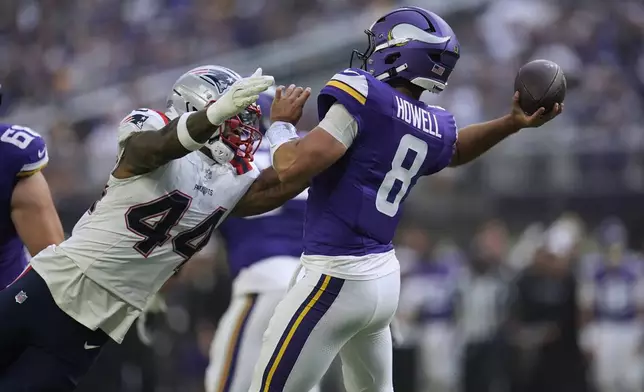 Minnesota Vikings quarterback Sam Howell (8) passes under pressure from New England Patriots linebacker K'Lavon Chaisson (44) during the first half of a preseason NFL football game Saturday, Aug. 16, 2025, in Minneapolis. (AP Photo/Abbie Parr)