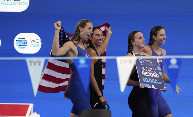 Athletes of team United States celebrate after winning gold medal in the women's 4x100-meter medley relay final at the World Aquatics Championships in Singapore, Sunday, Aug. 3, 2025. (AP Photo/Vincent Thian)