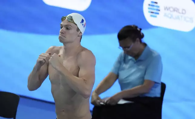 Leon Marchand of France prepares to compete in the men's 400-meter individual medley heats at the World Aquatics Championships in Singapore, Sunday, Aug. 3, 2025. (AP Photo/Lee Jin-man)