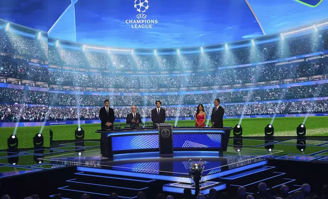 From left: Former soccer star Zlatan Ibrahimovic, UEFA Deputy General Secretary Giorgio Marchetti and former Brazilian player Kaka attend the Champions League soccer league phase draw in Monaco, Thursday, Aug. 28, 2025. (AP Photo/Laurent Cipriani)