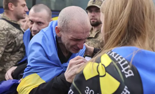 A Ukrainian soldier cries after returning from captivity following a POWs exchange between Russia and Ukraine, in Chernyhiv region, Ukraine, Sunday, Aug. 24, 2025. (AP Photo)