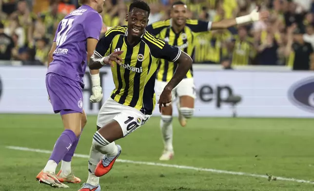 Fenerbahce's Jhon Duran celebrates his side's second goal during a Champions League third qualifying round second leg soccer match between Fenerbahce and Feyenoord at the Ulker stadium, in Istanbul, Turkey, Tuesday, Aug. 12, 2025. (Huseyin Yavuz/Dia Photo via AP)