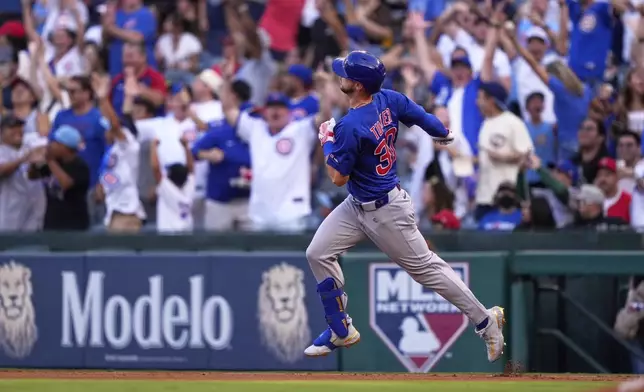 Chicago Cubs' Kyle Tucker rounds first after hitting a solo home run during the first inning of a baseball game against the Los Angeles Angels, Friday, Aug. 22, 2025, in Anaheim, Calif. (AP Photo/Mark J. Terrill)