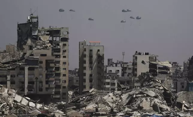 Humanitarian aid is airdropped over Gaza City, Gaza Strip, July 28, 2025. (AP Photo/Jehad Alshrafi)