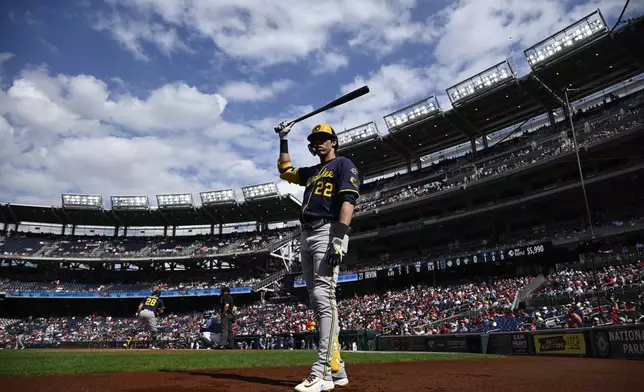 Milwaukee Brewers' Christian Yelich waits on deck during the first inning of a baseball game against the Washington Nationals, Saturday, Aug. 2, 2025, in Washington. (AP Photo/Nick Wass)