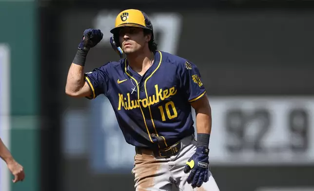 Milwaukee Brewers' Sal Frelick gestures at second base after he doubled during the first inning of a baseball game against the Washington Nationals, Saturday, Aug. 2, 2025, in Washington. (AP Photo/Nick Wass)