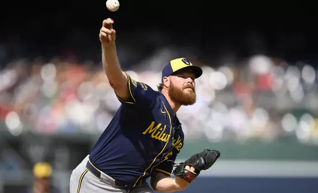 Milwaukee Brewers starting pitcher Brandon Woodruff throws during the first inning of a baseball game against the Washington Nationals, Saturday, Aug. 2, 2025, in Washington. (AP Photo/Nick Wass)