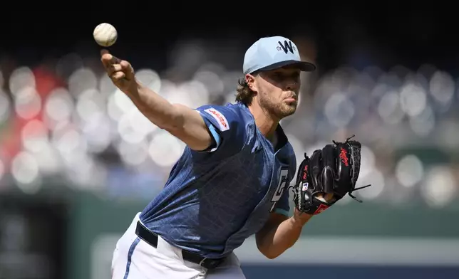Washington Nationals starting pitcher Jake Irvin throws during the first inning of a baseball game against the Milwaukee Brewers, Saturday, Aug. 2, 2025, in Washington. (AP Photo/Nick Wass)