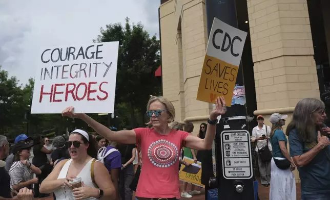Workers and supporters gather to rally for the departing scientific leaders at the Centers for Disease Control and Prevention outside the CDC headquarters, Thursday, Aug. 28, 2025, in Atlanta. (AP Photo/Ben Gray)