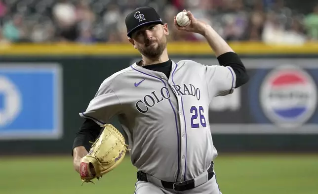 Colorado Rockies pitcher Austin Gomber throws against the Arizona Diamondbacks in the first inning of a baseball game, Friday, Aug. 8, 2025, in Phoenix. (AP Photo/Rick Scuteri)