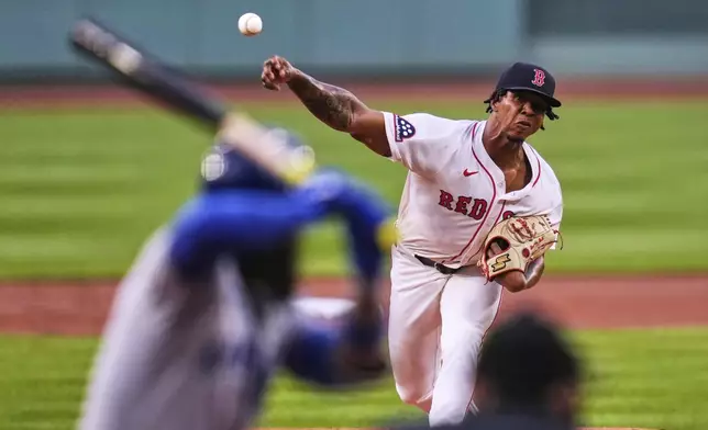 Boston Red Sox pitcher Brayan Bello delivers during the first inning of a baseball game against the Kansas City Royals at Fenway Park, Monday, Aug. 4, 2025, in Boston. (AP Photo/Charles Krupa)