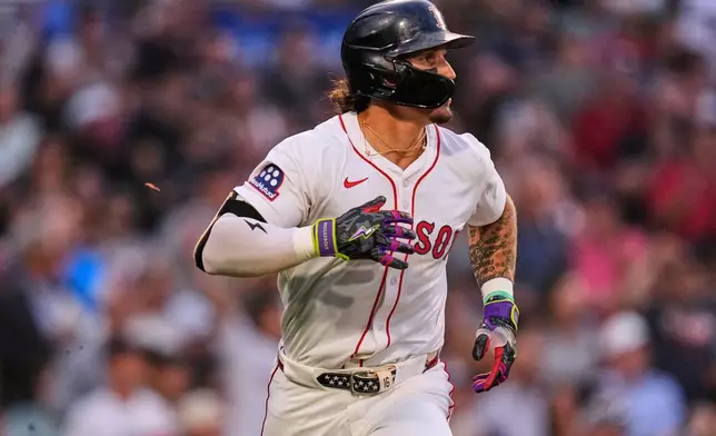 Boston Red Sox's Jarren Duran watches the flight of his three-run home run in the first inning of a baseball game against the Kansas City Royals at Fenway Park, Monday, Aug. 4, 2025, in Boston. (AP Photo/Charles Krupa)