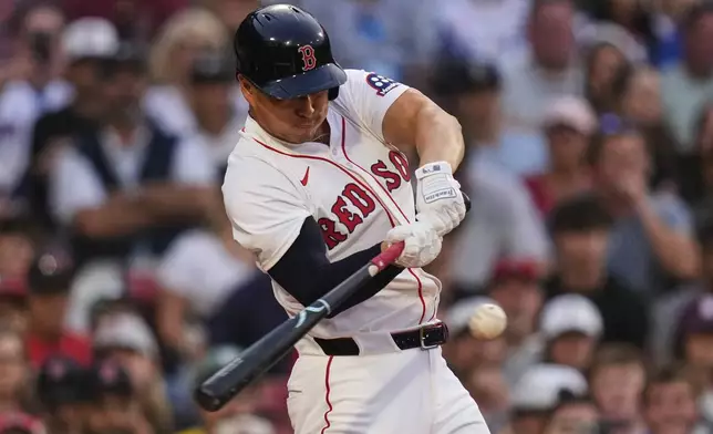 Boston Red Sox designated hitter Rob Refsnyder connects for a two-RBI single during the first inning of a baseball game against the Kansas City Royals at Fenway Park, Monday, Aug. 4, 2025, in Boston. (AP Photo/Charles Krupa)