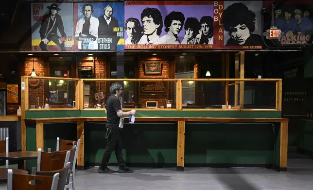 A mural of past concerts at Toad's Place is displayed above one of the bars in New Haven, Conn., on Friday, May 9, 2025. (AP Photo/Jessica Hill)