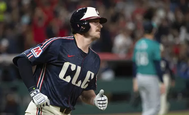 Cleveland Guardians' Kyle Manzardo rounds the bases after hitting a solo home run off Seattle Mariners starting pitcher George Kirby during the sixth inning of a baseball game, Friday, Aug. 29, 2025, in Cleveland. (AP Photo/Phil Long)