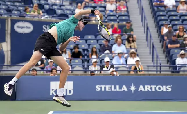 Alex Michelsen, of the United States, serves the ball against Lorenzo Musetti, of Italy, during a match at the National Bank Open men’s tennis tournament, Thursday, July 31, 2025, in Toronto. (Nathan Denette/The Canadian Press via AP)