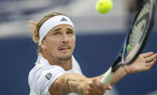 Alexander Zverev, of Germany, hits a backhand return to Matteo Arnaldi, of Italy, during their men's match at the National Bank Open tennis tournament in Toronto, Thursday July 31, 2025. (Frank Gunn/The Canadian Press via AP)