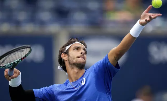 Lorenzo Musetti, of Italy, serves against Alex Michelsen, of the United, States, during a match at the National Bank Open men’s tennis tournament, Thursday, July 31, 2025, in Toronto. (Nathan Denette/The Canadian Press via AP)