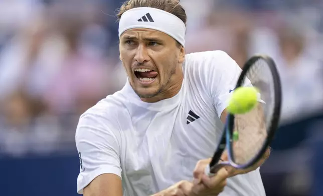 Alexander Zverev, of Germany, hits a backhand return to Matteo Arnaldi, of Italy, during their men's match at the National Bank Open tennis tournament in Toronto, Thursday, July 31, 2025. (Frank Gunn/The Canadian Press via AP)