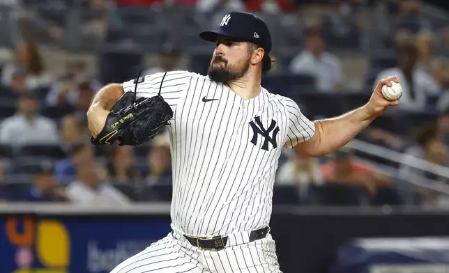 New York Yankees' Carlos Rodón throws during the sixth inning of a baseball game against the Boston Red Sox, Sunday, Aug. 24, 2025, in New York. (AP Photo/Noah K. Murray)