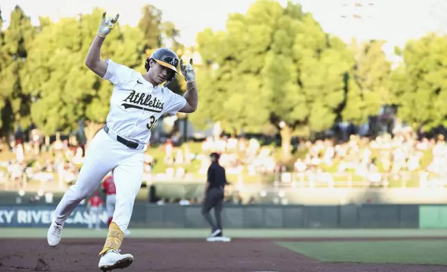 Athletics' Colby Thomas runs the bases after hitting a two-run home run during the first inning of a baseball game against the Los Angeles Angels, Saturday, Aug. 16, 2025, in West Sacramento, Calif. (AP Photo/Sara Nevis)