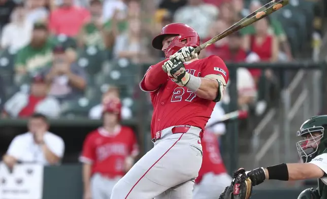 Los Angeles Angels' Mike Trout hits a single during the first inning of a baseball game against the Athletics, Saturday, Aug. 16, 2025, in West Sacramento, Calif. (AP Photo/Sara Nevis)