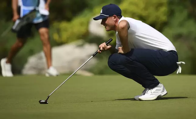 Ludvig Åberg, of Sweden, lines up a putt on the 18th hole during the second round of the BMW Championship golf tournament Friday, Aug. 15, 2025, in Owings Mills, Md. (AP Photo/Nick Wass)
