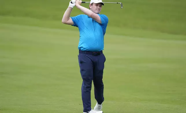 Robert Macintyre, of Scotland, hits from the first fairway during the first round of the Tour Championship golf tournament, Thursday, Aug. 21, 2025, in Atlanta. (AP Photo/Mike Stewart)