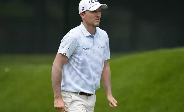 Russell Henley walks on the first fairway during the first round of the Tour Championship golf tournament, Thursday, Aug. 21, 2025, in Atlanta. (AP Photo/Mike Stewart)