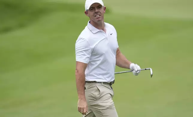 Rory McIlroy, of Northern Ireland, watches his shot on the first fairway during the first round of the Tour Championship golf tournament, Thursday, Aug. 21, 2025, in Atlanta. (AP Photo/Mike Stewart)
