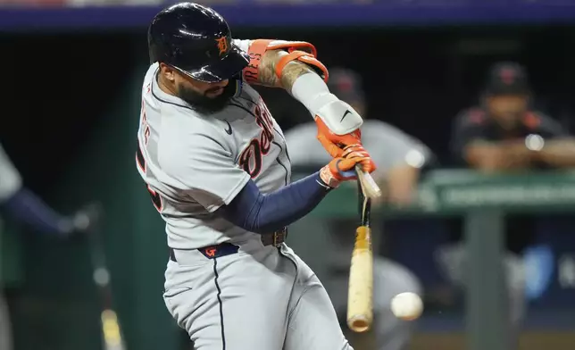 Detroit Tigers' Gleyber Torres breaks his bat as he hits a single during the fourth inning of a baseball game against the Kansas City Royals, Friday, Aug. 29, 2025, in Kansas City, Mo. (AP Photo/Charlie Riedel)